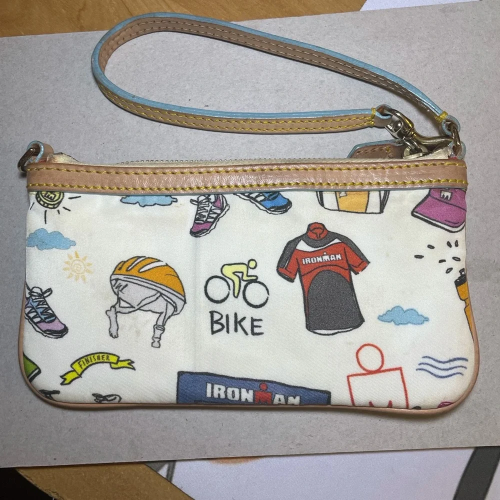 Dooney & Bourke Disney Sketch Marathon Wristlet 70.3 Run is a small wristlet